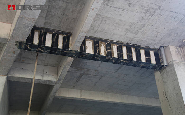 Beam strengthening by fiber wrapping Beam strengthening by fiber wrapping